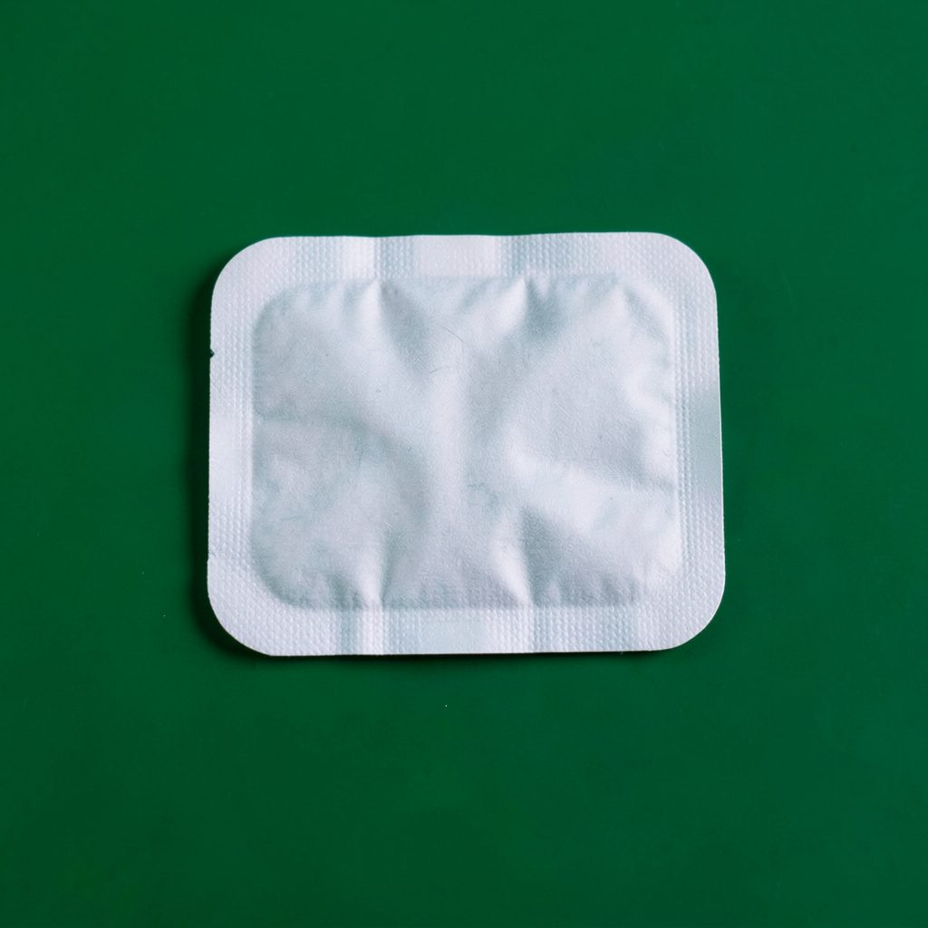 Fentanyl patches on a clean white studio backdrop with soft diffused lighting